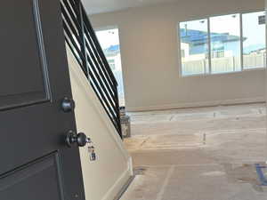 Foyer featuring stairs and recessed lighting