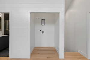 Hall featuring light wood-type flooring