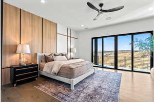 Bedroom featuring access to exterior, ceiling fan, wood finished floors, and recessed lighting