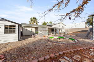 Back of property with a patio