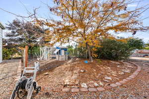 View of yard featuring exterior structure and an outbuilding