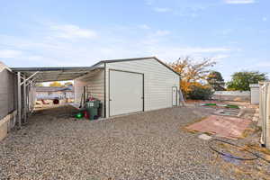 View of outbuilding with a carport