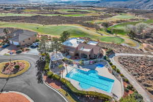 Bird's eye view of a mountainous background and a golf course