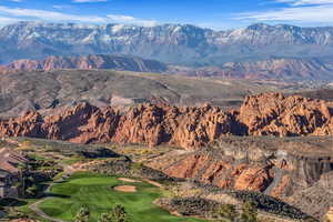 View of mountain background featuring a local golf course