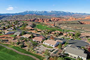 Aerial view of residential area featuring a mountain backdrop