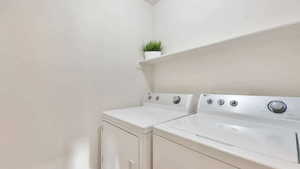 Laundry area featuring separate washer and dryer