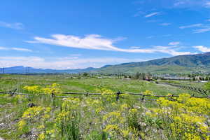 View of mountain background featuring rural landscape