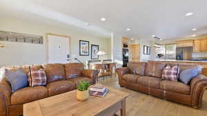 Living room featuring recessed lighting and light wood-type flooring