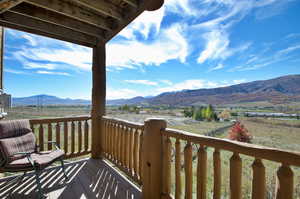 Balcony view featuring a mountain view