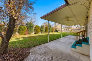 View of patio / terrace featuring ceiling fan and outdoor lighting