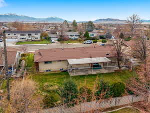 Aerial perspective of suburban area featuring a mountain backdrop