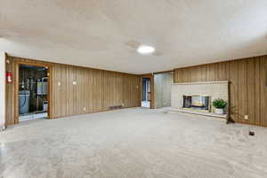 Living Room looking into utility room with Air Purifier, Water Softer, instant hot water and lots of storage space