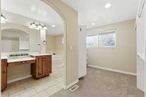 Closet looking into Primary suite Bathroom