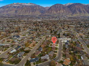 View of property location with nearby suburban area and mountains