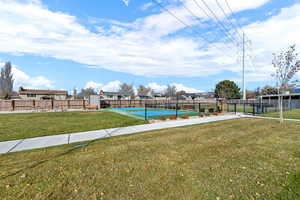 View of property's community featuring community basketball court, a patio, and a residential view