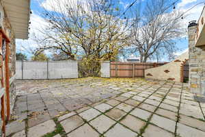 Fenced backyard featuring a patio