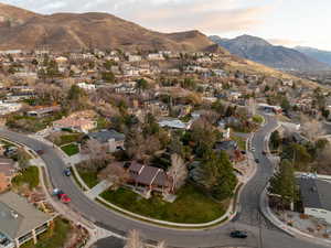 View of property location with mountains and nearby suburban area
