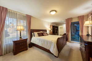 Primary bedroom suite with atrium, walk-in closet and luxurious bathroom