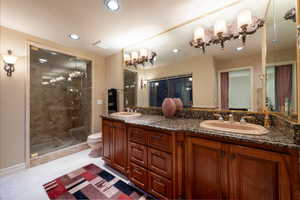 Full primary bathroom with double vanity, a shower, recessed lighting, and a jacuzzi tub