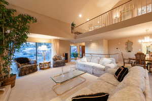 Lovely living room with vaulted ceilings, gorgeous views and reading loft above