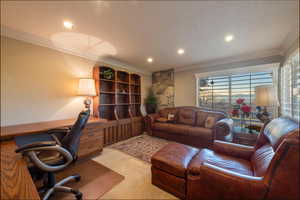 Office with ornamental molding, light colored carpet, recessed lighting, plantation shutters and walkout to patio with city views