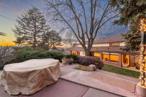 Backyard of home with patio and terraced landscaping