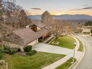 Aerial view of front of home looking west at dusk