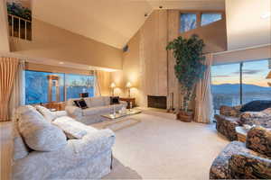 Lovely living room with vaulted ceilings, fireplace and gorgeous views