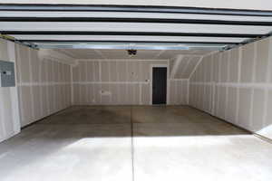 Garage featuring electric panel