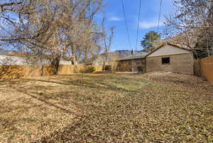 View of fenced backyard
