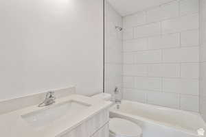 Bathroom featuring vanity and shower / bath combination