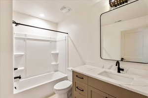 Full bath with vanity and shower / washtub combination