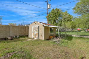 View of shed featuring a fenced backyard