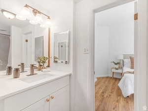 Full bath featuring vanity and light wood-style floors