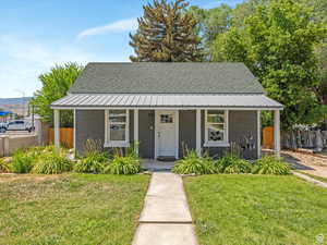Bungalow-style house with a porch and a shingled roof
