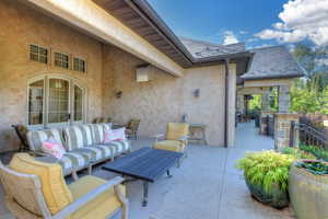 View of patio with an outdoor living space