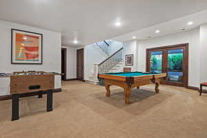 Playroom featuring light colored carpet, recessed lighting, pool table, and french doors