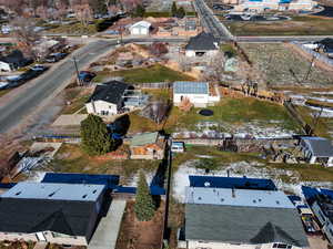 Aerial view of property's location with nearby suburban area