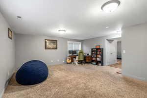 Interior space featuring an office area and carpet floors