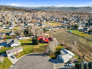 View of property location featuring nearby suburban area and a mountain backdrop