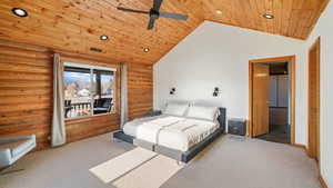 Carpeted 2nd main level bedroom with large walk-in closet, an ensuite bathroom, recessed lighting, ceiling fan, and high vaulted ceiling