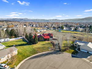 Aerial perspective of suburban area with a mountain backdrop
