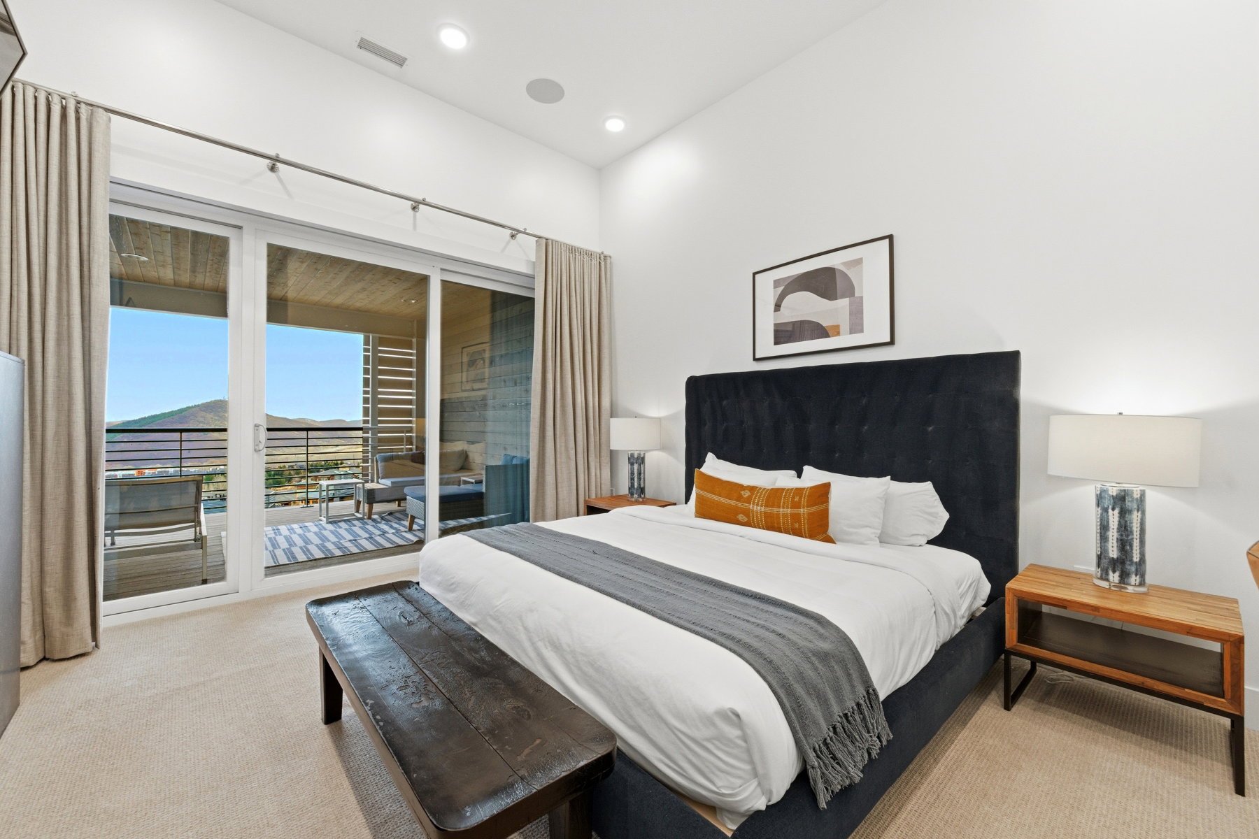 Bedroom with light colored carpet and access to exterior