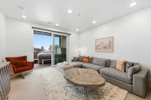 Living room featuring carpet and recessed lighting