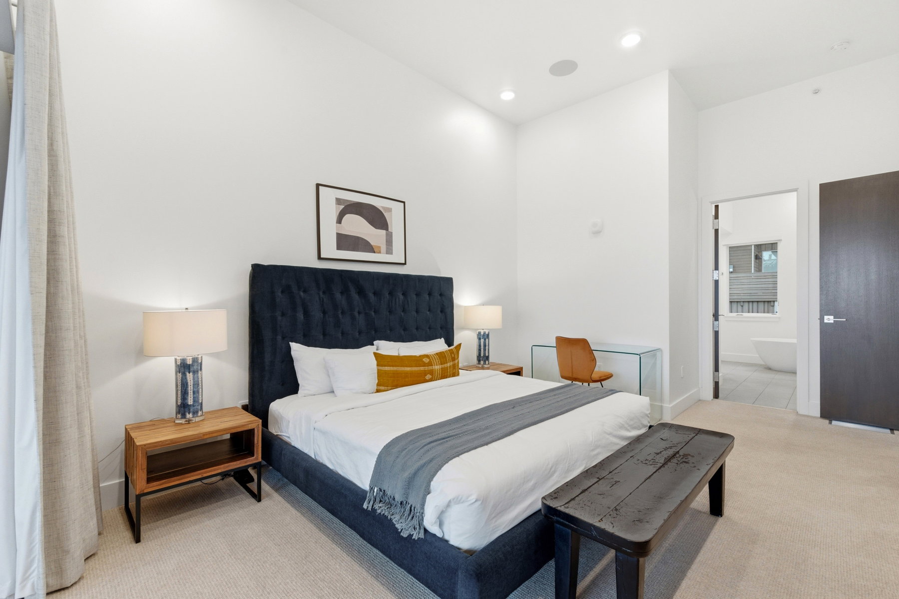 Bedroom with carpet, ensuite bathroom, and recessed lighting