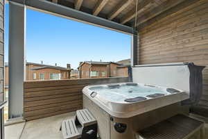 View of patio featuring a hot tub