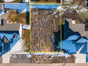 Snowy aerial view with property boundaries highlighted