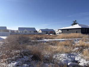 View of yard layered in snow