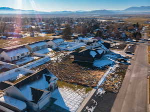 Aerial perspective of suburban area featuring a mountain backdrop