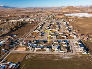Aerial view of property's location with nearby suburban area and rural landscape